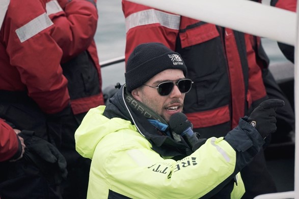 whale watching guide on a boat