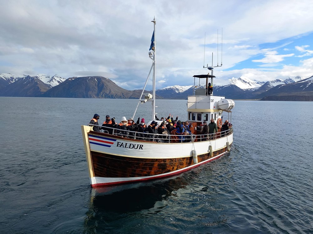 The oak whale watching boat arriving to flatey with the first passengers of the Grand Opening